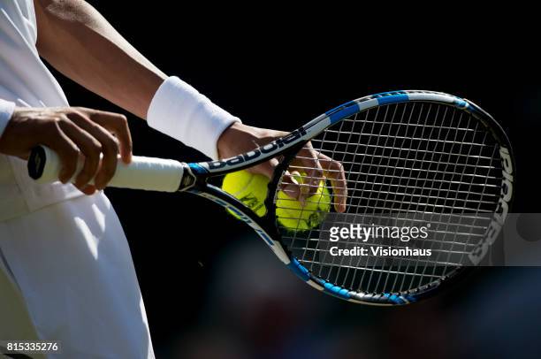Close up of Dustin Brown of Germany's Babolat racket during his match against Andy Murray of Great Britain on day three of the Wimbledon Lawn Tennis...