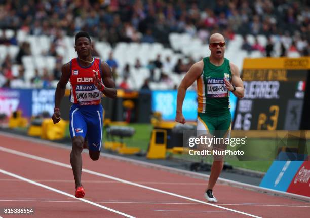 Leinier Savon Pineda of Cuba and Hilton Langenhoven of South Africa Men's 100m Semi FinalHeat 1 during IPC World Para Athletics Championships at...