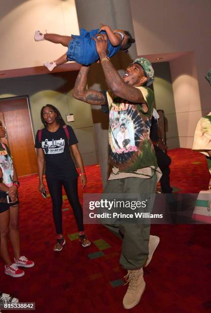 Iman Shumpert and Iman Tayla Shumpert Jr attend the 2017 V103 Car and Bike Show at GWCC Hall on July 15, 2017 in Atlanta, Georgia.