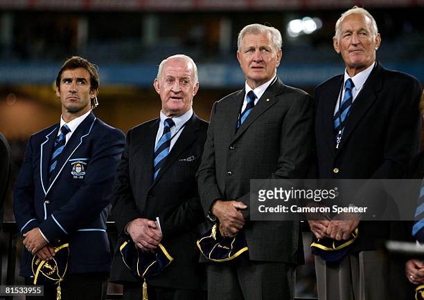 Andrew Johns, John Raper, Ron Coote and Norm Provan pose on stage after being inducted into the NSW Team of the Century before match one of the ARL...