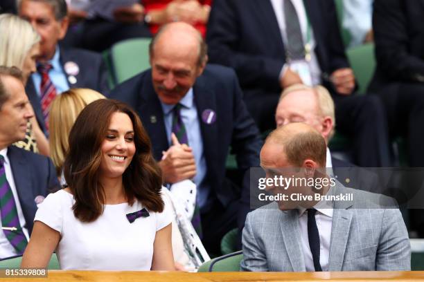 Prince William, Duke of Cambridge and Catherine, Duchess of Cambridge look on from the centre court royal box prior to the Gentlemen's Singles final...