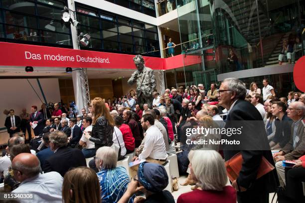 People listen to Chancellor Candidate and Chairman of the Social Democratic Party Martin Schulz speaking during the event 'Zukunft. Gerechtigkeit....
