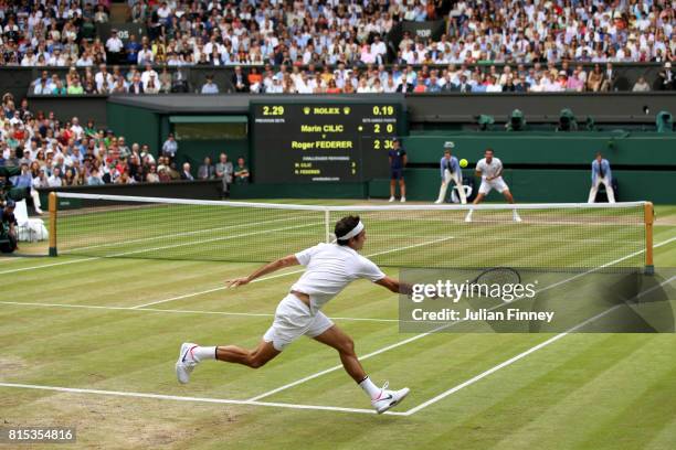 Roger Federer of Switzerland plays a forehand during the Gentlemen's Singles final against Marin Cilic of Croatia on day thirteen of the Wimbledon...