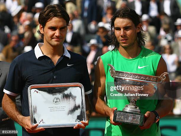 Roger Federer of Switzerland and Rafael Nadal of Spain with their trophies after the Men's Singles Final match on day fifteen of the French Open at...