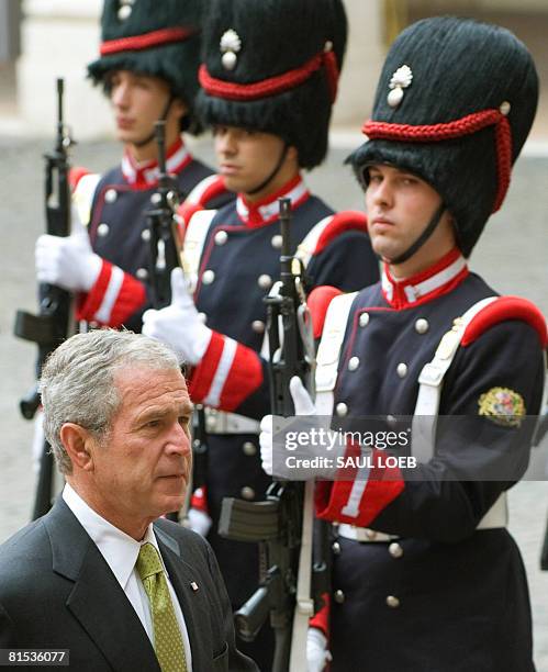 President George W. Bush walks past the Granatieri Di Sardegna of the Guardia D'Onore upon arrival at Quirinale Palace in Rome, Italy, June 12, 2008...