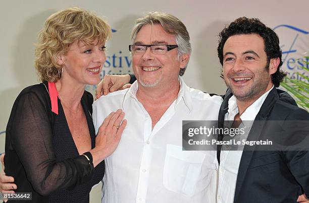 Actress Cecile Auclert and actors Christian Rauth and Sebastien Knafo attend a photocall promoting the television series "Pere & Maire" on the fifth...