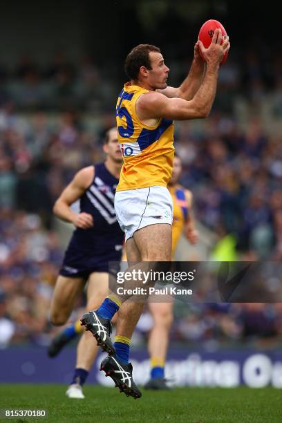 Shannon Hurn of the Eagles marks the ball during the round 17 AFL match between the Fremantle Dockers and the West Coast Eagles at Domain Stadium on...