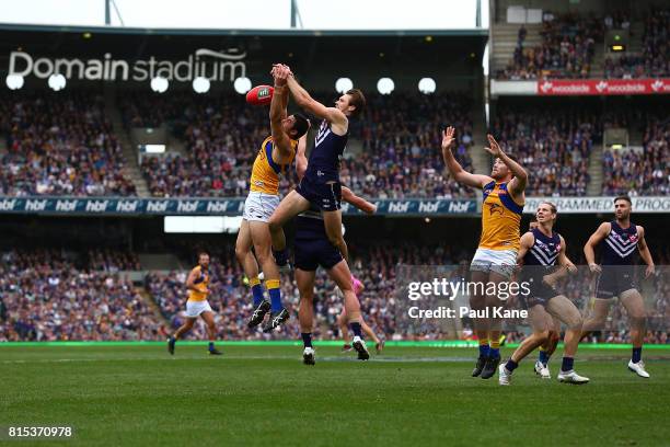 Tom Barrass of the Eagles and Joel Hamling of the Dockers contest a mark during the round 17 AFL match between the Fremantle Dockers and the West...