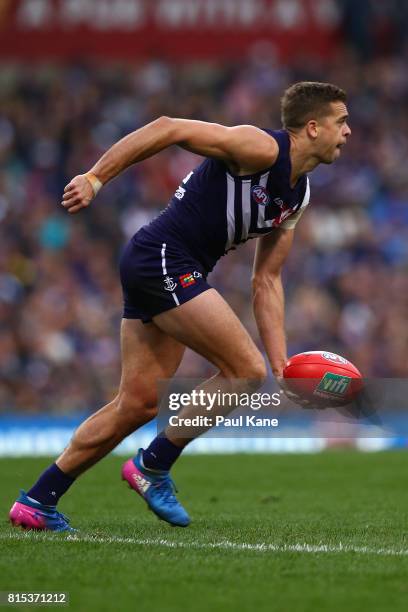 Stephen Hill of the Dockers looks to handball during the round 17 AFL match between the Fremantle Dockers and the West Coast Eagles at Domain Stadium...