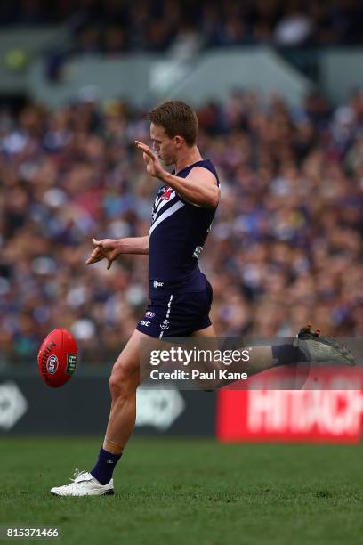 Ryan Nyhuis of the Dockers kicks the ball during the round 17 AFL match between the Fremantle Dockers and the West Coast Eagles at Domain Stadium on...