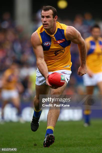 Shannon Hurn of the Eagles handballs during the round 17 AFL match between the Fremantle Dockers and the West Coast Eagles at Domain Stadium on July...