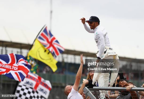 Race winner Lewis Hamilton of Great Britain and Mercedes GP celebrates with the fans after the Formula One Grand Prix of Great Britain at Silverstone...