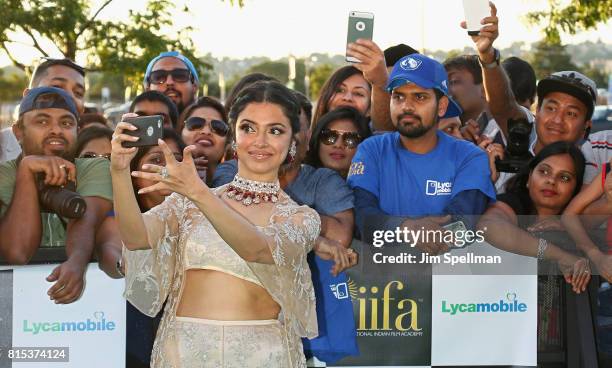 Actress Divya Khosla Kumar poses with the fans at the 2017 International Indian Film Academy Festival at MetLife Stadium on July 14, 2017 in East...