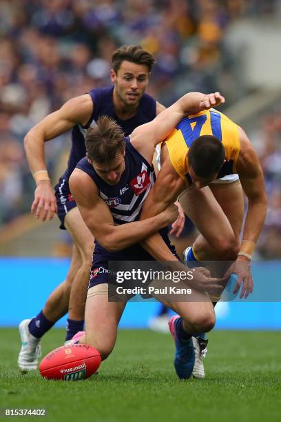 Nick Suban of the Dockers and Liam Duggan of the Eagles contest for the ball during the round 17 AFL match between the Fremantle Dockers and the West...