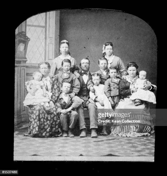 Mormon family demonstrate the faith's tendency towards polygamy, circa 1890.