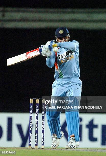 Indian Virender Sehwag hits a ball off the bowling of Bangladeshi Dollar Mahmud during the third One Day International Tri-series match between...