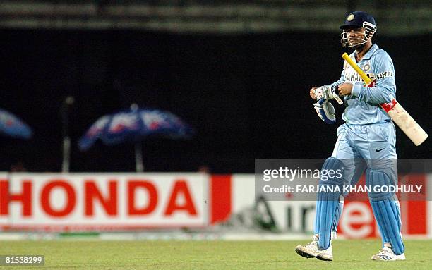 Indian cricketer Virender Sehwag leaves the pitch on being dismissed off the bowling of Bangladesh bowler Dollar Mahmud during the third One Day...