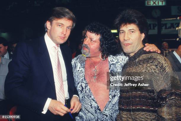 Businessman Donald Trump and Professional Wrestler Lou Albano with Son ringside at Tyson vs Holmes Convention Hall in Atlantic City, New Jersey...