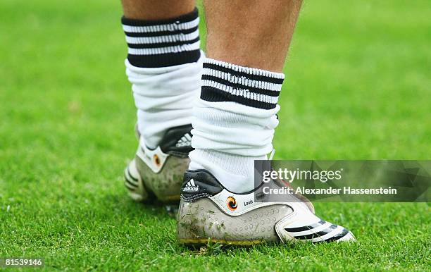The name Louis appears on the football boots of Lukas Podolski of Germany ahed of the UEFA EURO 2008 Group B match between Croatia and Germany at...