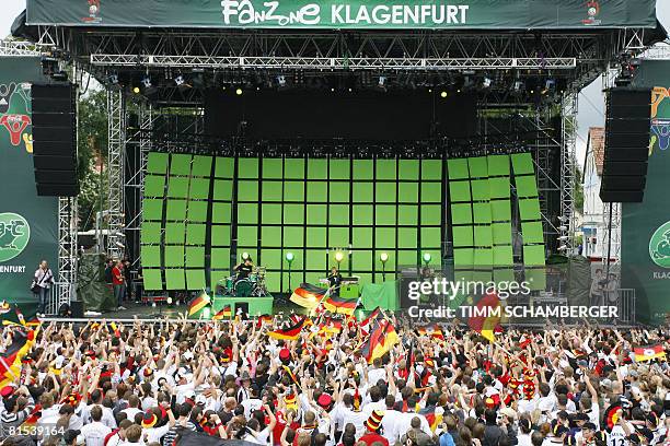 Supporters of the German team listen to the music group Sportfreunde Stiller in the fan zone on June 12, 2008 in Klagenfurt ahead of the Euro 2008...