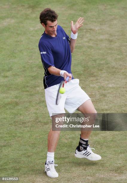 Andy Murray of Great Britain hits a backhand during the Men's Singles third round match against Ernests Gulbis of Latvia on Day 4 of the Artois...