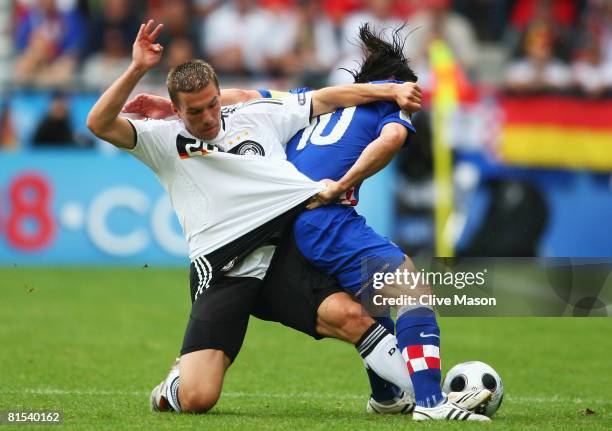 Lukas Podolski of Germany and Niko Kovac of Croatia battle for the ball during the UEFA EURO 2008 Group B match between Croatia and Germany at...
