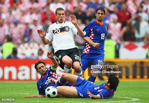 Lukas Podolski of Germany is challenged by Niko Kovac , Niko Kranjcar and Vedran Corluka of Croatia during the UEFA EURO 2008 Group B match between...