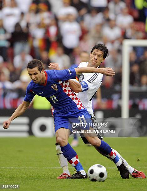 Croatian midfielder Darijo Srna fights for the ball with German midfielder Michael Ballack during their Euro 2008 Championships Group B football...