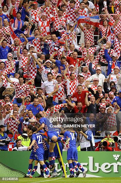 Crotatian players celebrate with supporters after Croatian midfielder Darijo Srna scored the opening goal against Germany during their Euro 2008...