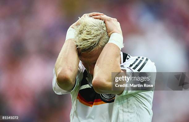 Bastian Schweinsteiger of Germany holds his head in frustration during the UEFA EURO 2008 Group B match between Croatia and Germany at Worthersee...