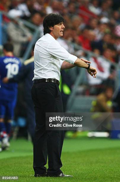 Joachim Loew, head coach of Germany points to his watch during the UEFA EURO 2008 Group B match between Croatia and Germany at Worthersee Stadion on...