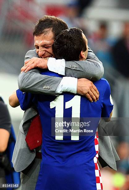 Slaven Bilic, head coach of Croatia and Darijo Srna celebrate victory after the UEFA EURO 2008 Group B match between Croatia and Germany at...