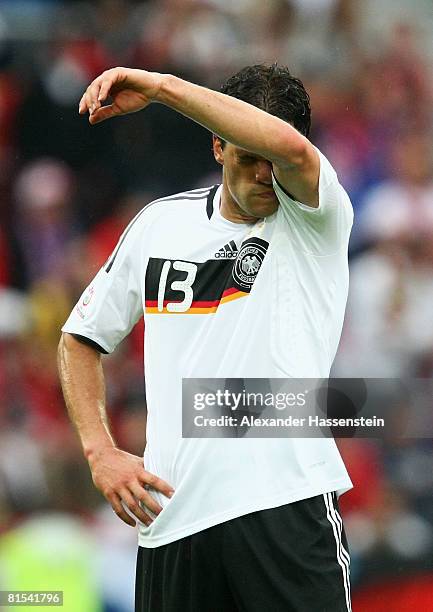 Michael Ballack of Germany wipes his face during the UEFA EURO 2008 Group B match between Croatia and Germany at Worthersee Stadion on June 12, 2008...