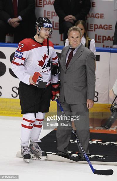 Mike Green of Canada is presented with a watch after his teams win over Sweden during the Semifinal round of the International Ice Hockey Federation...