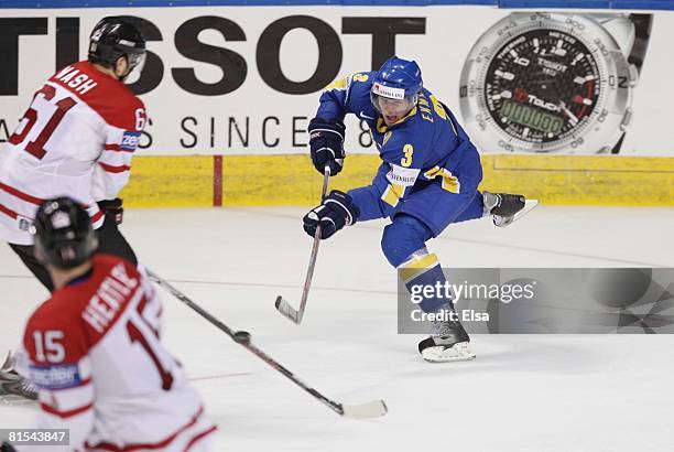 Nils Ekman of Sweden shoots against Rick Nash of Canada during the Semifinal round of the International Ice Hockey Federation World Championship at...