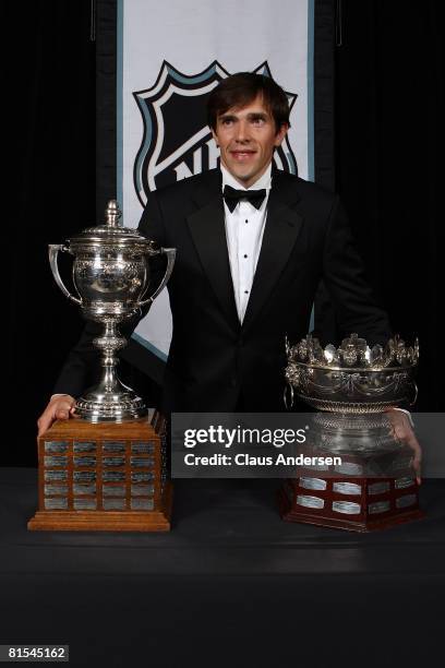 Pavel Datsyuk of the Detroit Red Wings poses with Frank J. Selke Trophy and the Lady Bing Memorial Trophy during the 2008 NHL Awards at the at the...