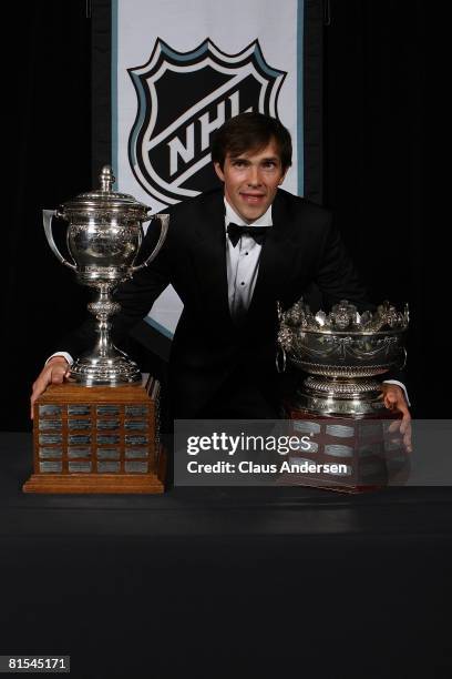 Pavel Datsyuk of the Detroit Red Wings poses with Frank J. Selke Trophy and the Lady Bing Memorial Trophy during the 2008 NHL Awards at the at the...