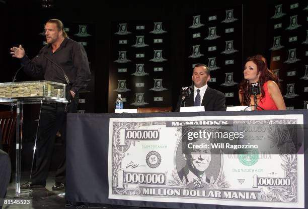 Champion Triple H, contest winner Steve Rosenzweig and WWE Diva Maria attend the announcement of the First McMahon Million Dollar Mania Winners at...