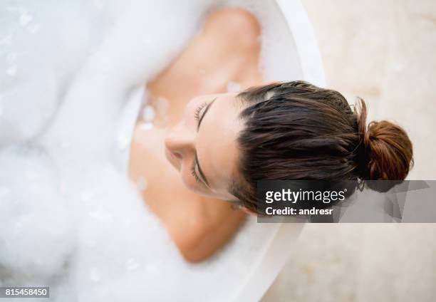 beautiful woman taking a bath - taking a bath stock pictures, royalty-free photos & images