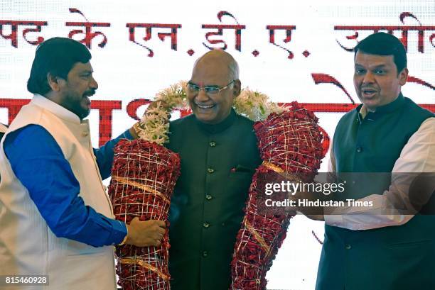 Maharashtra Chief Minister Devendra Fadnavis and leader of Republican Party Ramdas Athawale greet NDA Presidential candidate Ramnath Kovind, at...