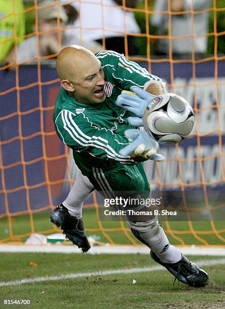 Goal keeper Matt Reis of the New England Revolution makes a save on Stuart Holden's of the Houston Dynamo penalty kick on June 12, 2008 at Robertson...