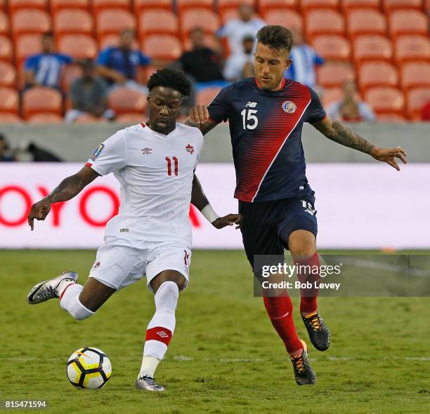 Tossing Ricketts of Canada races past the defense of Francisco Calvo of Costa Rica at BBVA Compass Stadium on July 11, 2017 in Houston, Texas.