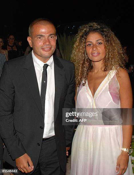 Egyptian singer Amr Diab and his wife Zeina attend the wedding party of Sherif Ramzi, the son of Egyptian producer Mohammed Ramzi, and Mona Fahmi,...