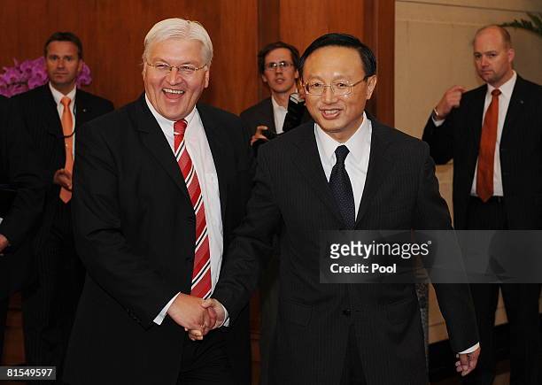 German Foreign Minister Frank-Walter Steinmeier shakes hands with his Chinese counterpart Yang Jiechi before their meeting June 13, 2008 in Beijing....