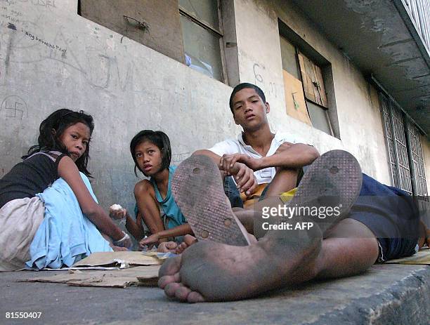 Philippines-homeless-children-streets" by Jason Gutierrez Abandoned children languish in the streets of Manila's sprawling market in Divisoria on...