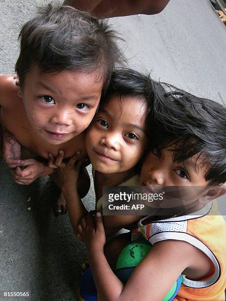 Philippines-homeless-children-streets" by Jason Gutierrez Homeless children are seen in Manila's sprawling market in Divisoria on April 7, 2008. A...