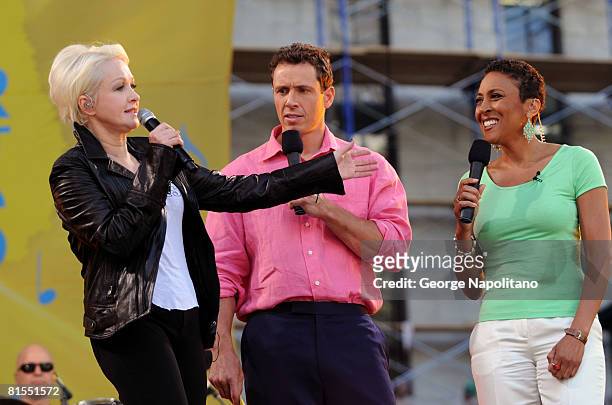 Cyndi Lauper, with co-hosts Robin Roberts and Chris Cuomo on ABC's "Good Morning America" on June 13, 2008 in Bryant Park in New York City.