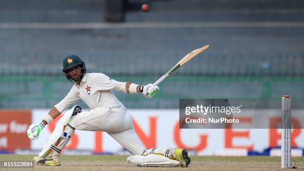 Zimbabwe cricketer Sikandar Raza plays a shot run during the third day's play of the only test cricket match between Sri Lanka and Zimbabwe at R...