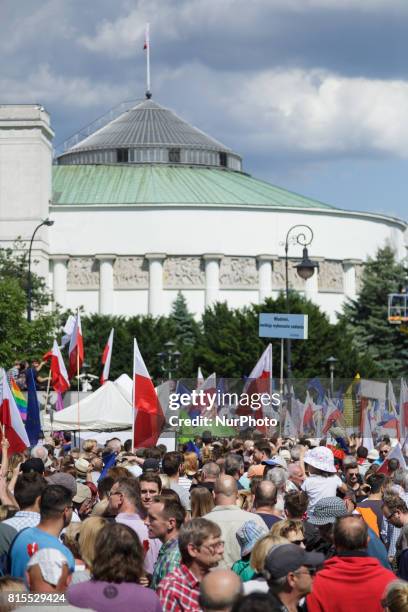 People participate in a protest in front of the Polish Parliament building in Warsaw, Poland on 16 July 2017. The demonstration was organized by...