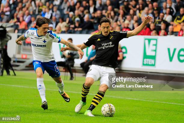 David Moberg Karlsson of IFK Norrkoping and Stefan Ishizaki of AIK during the Allsvenskan match between AIK and IFK Norrkoping at Friends arena on...